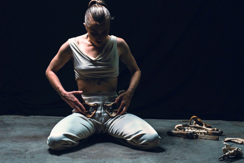 “A slow fall to the earth: Where scattered bones, gathered. Repetitions/repetitions/repetitions A life/death/regeneration.”Image from a photography series
